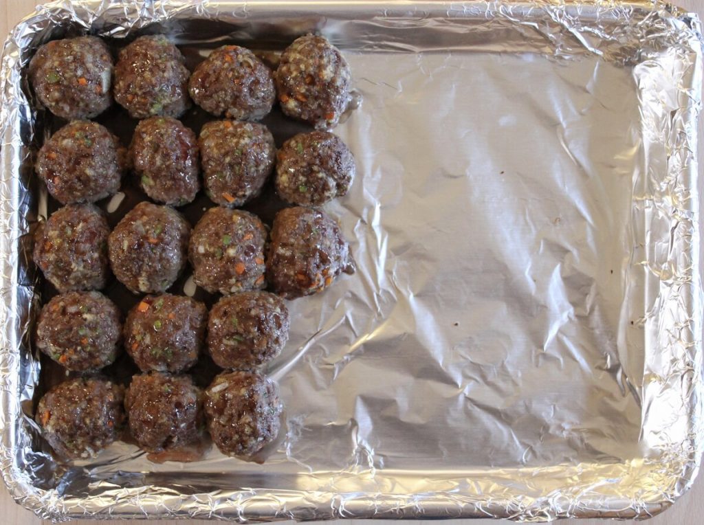 sheet pan of cooked meatballs