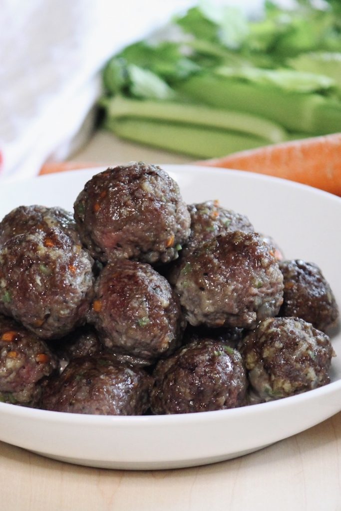 close up of cooked meatballs in the bowl