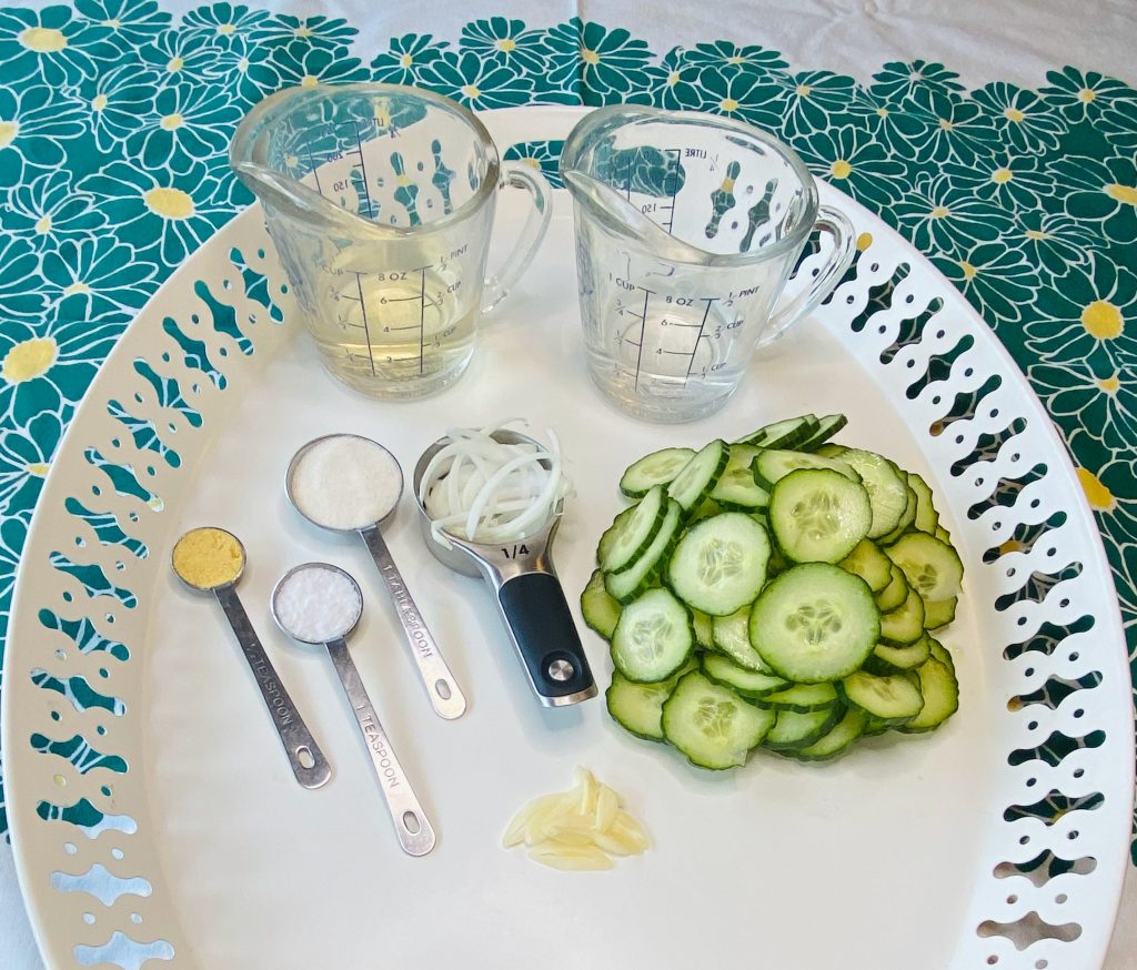 All the ingredients needed to make marinated cucumbers.