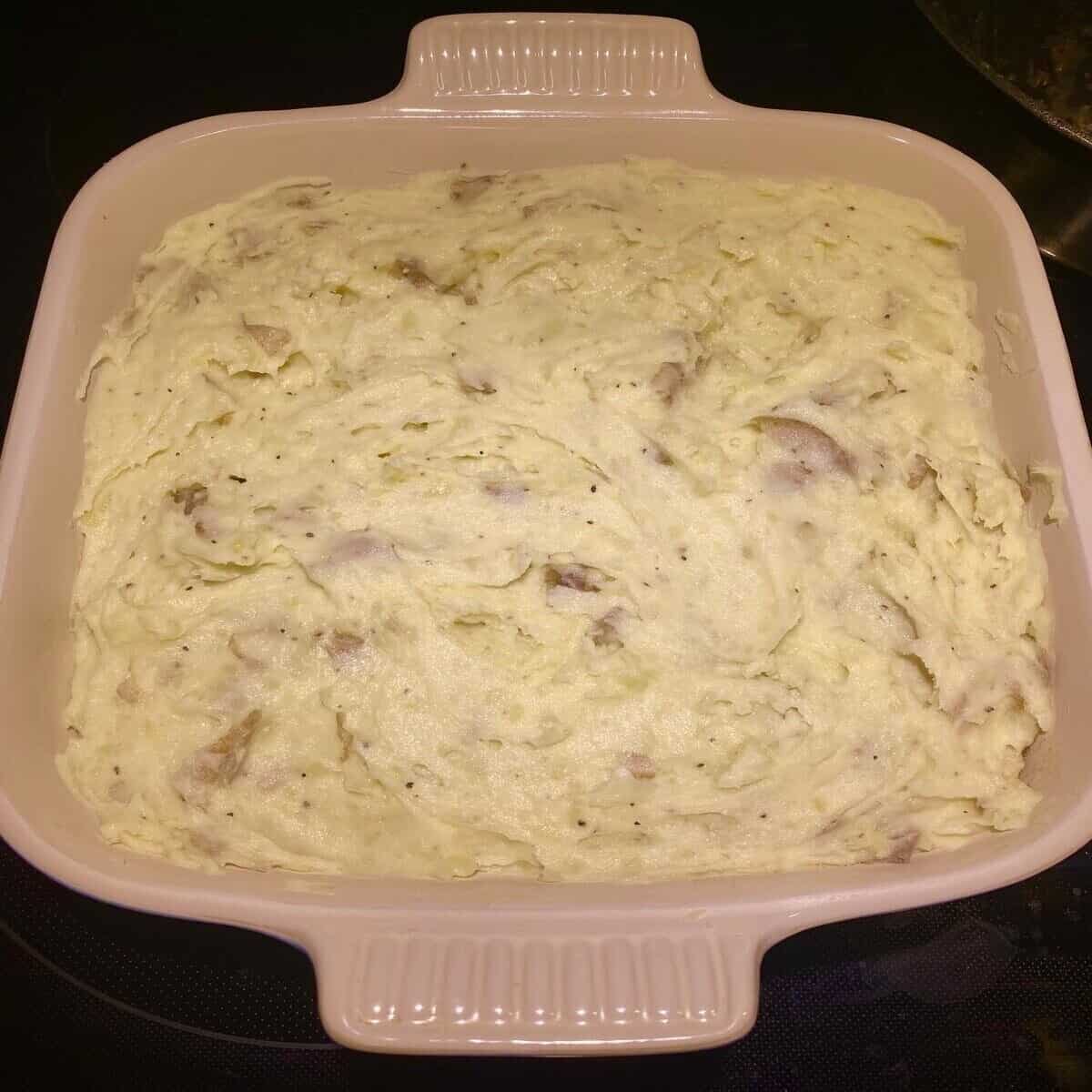 The finished casserole in a dish ready to be baked.