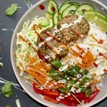 close up picture of thai inspired pork patty rice bowl.