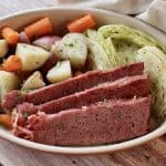 Feature photo for roasted corned beef with vegetables in a dish.