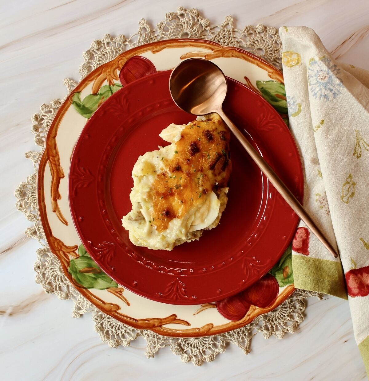 flatlay of single serving of anglesey eggs with a spoon and napkin.