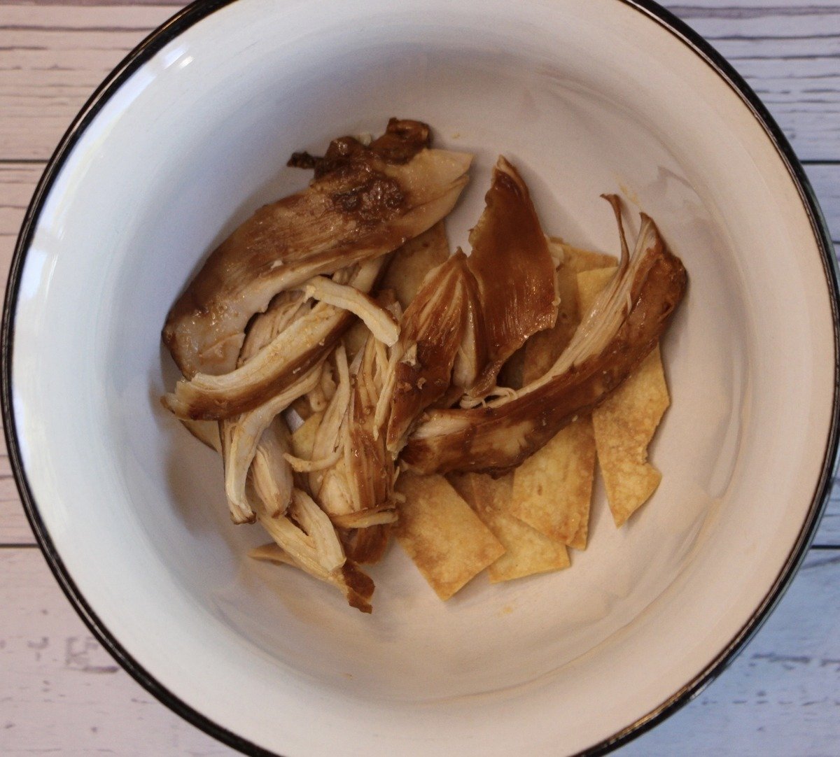 bowl with chicken and tortilla strips.