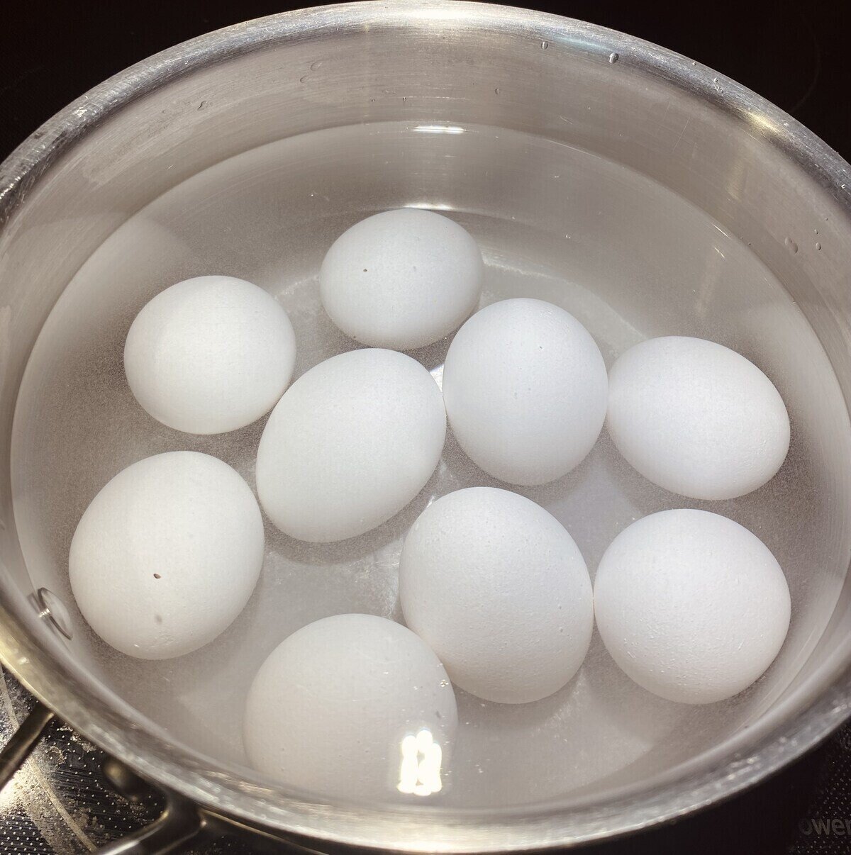 Eggs in a pot covered with water.