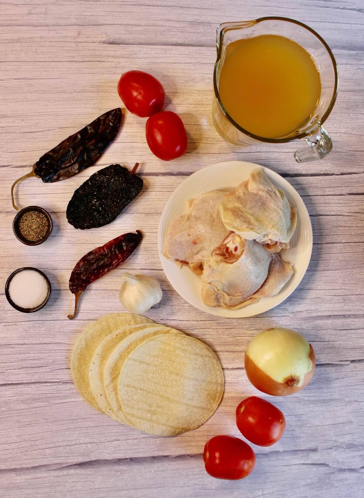 All the ingredients needed to make hearty chicken tortilla soup.