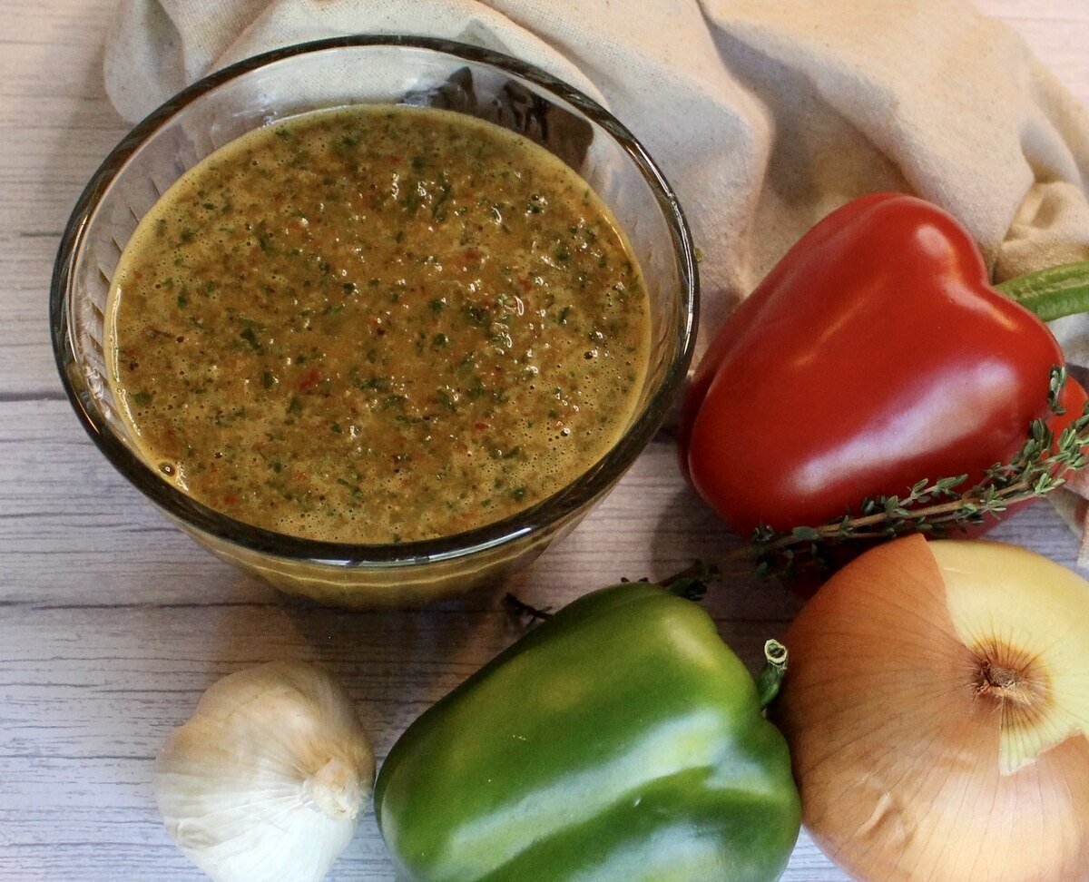 bowl of haitian epis seasoning base with vegetables and a napkin.