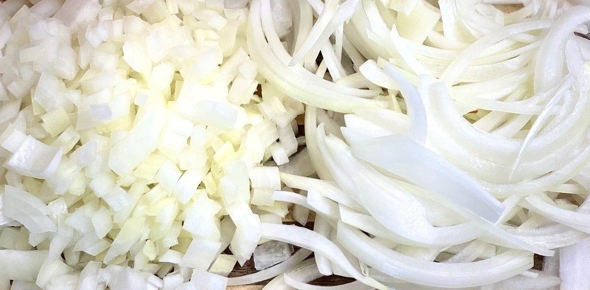 a pile of diced onions and julienned onions.