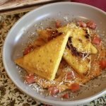 fried polenta in dish with aioli and parmesan.