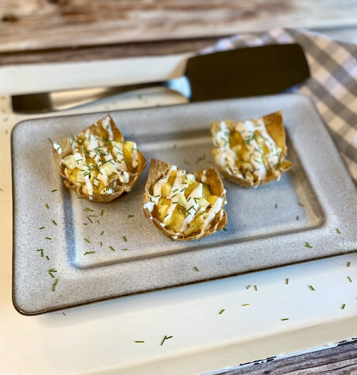 Wontons set up on a serving platter.