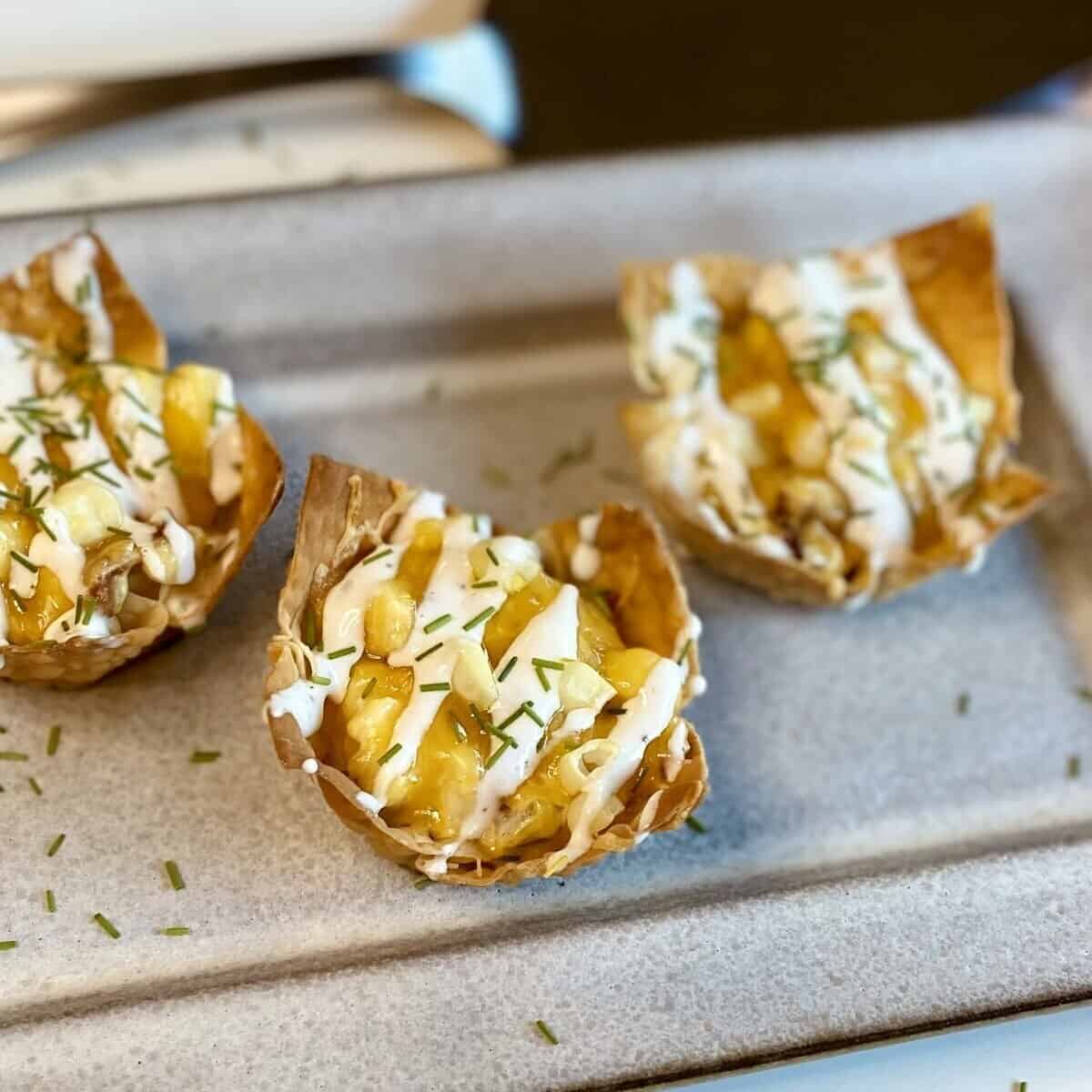 Creamy Corn and Bacon Wonton Cups with Ranch Crema - The Measured Scoop
