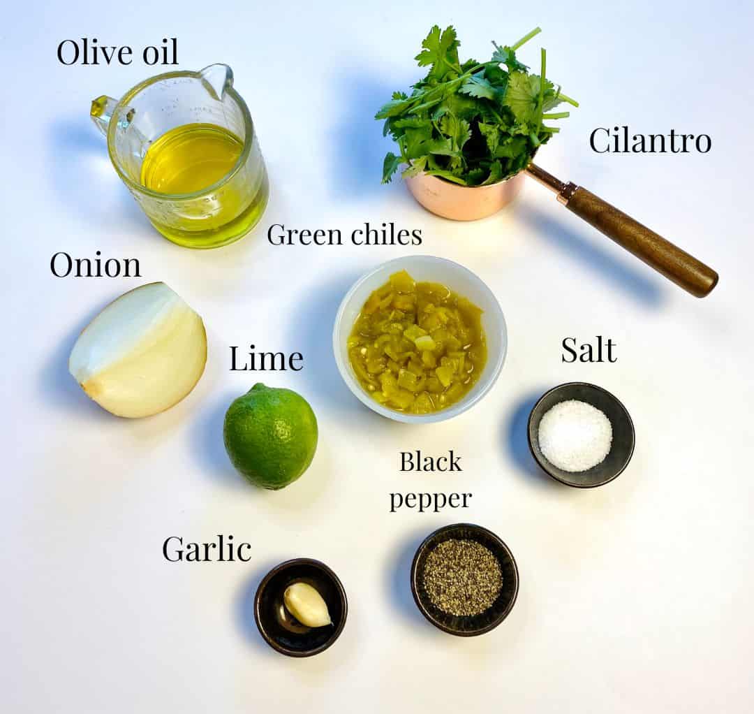 All the ingredients needed to make the green sauce (salsa verde).