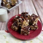 Feature photo for post of smores bars on a red plate with milk.