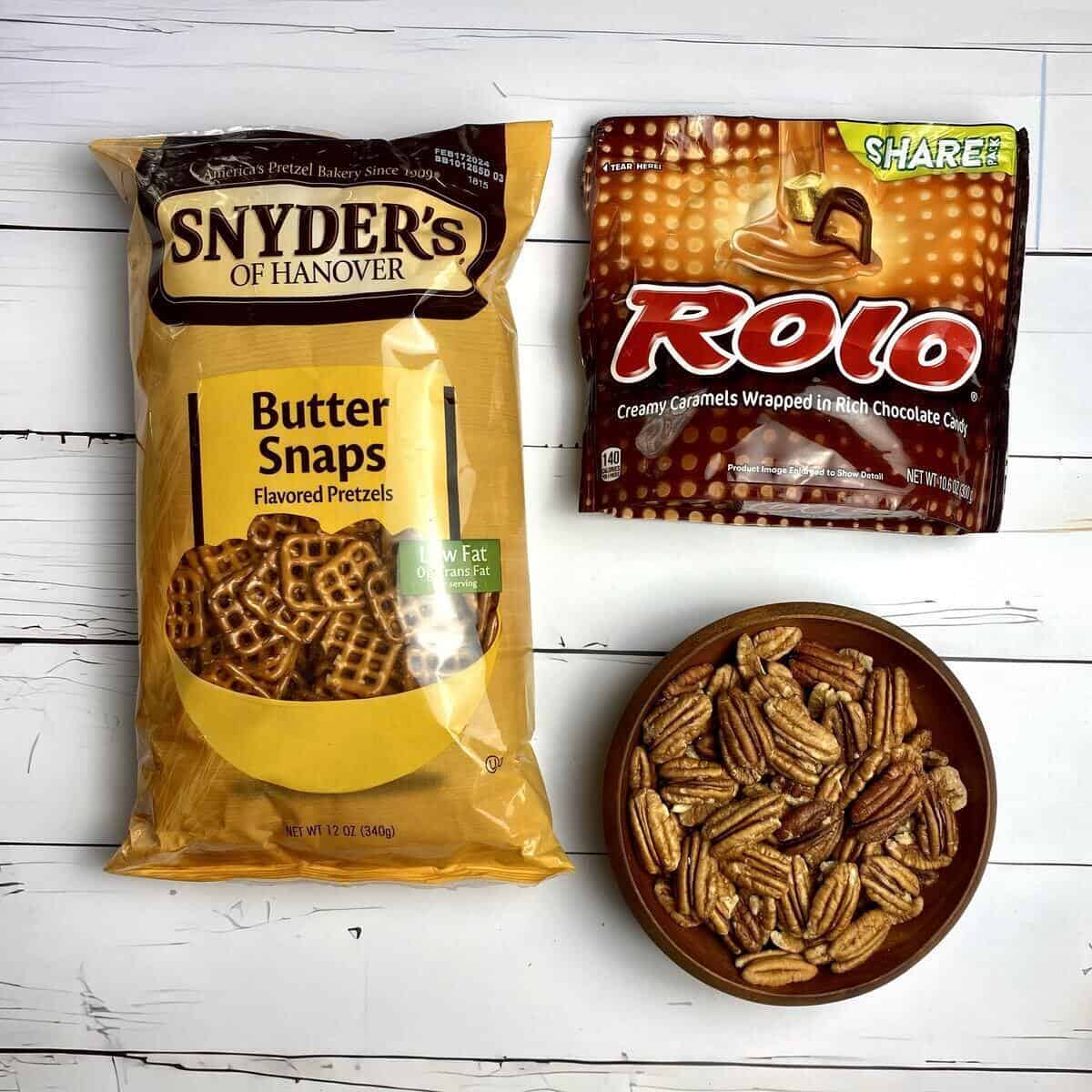 The ingredients used to make pecan turtles with Rolo candies.