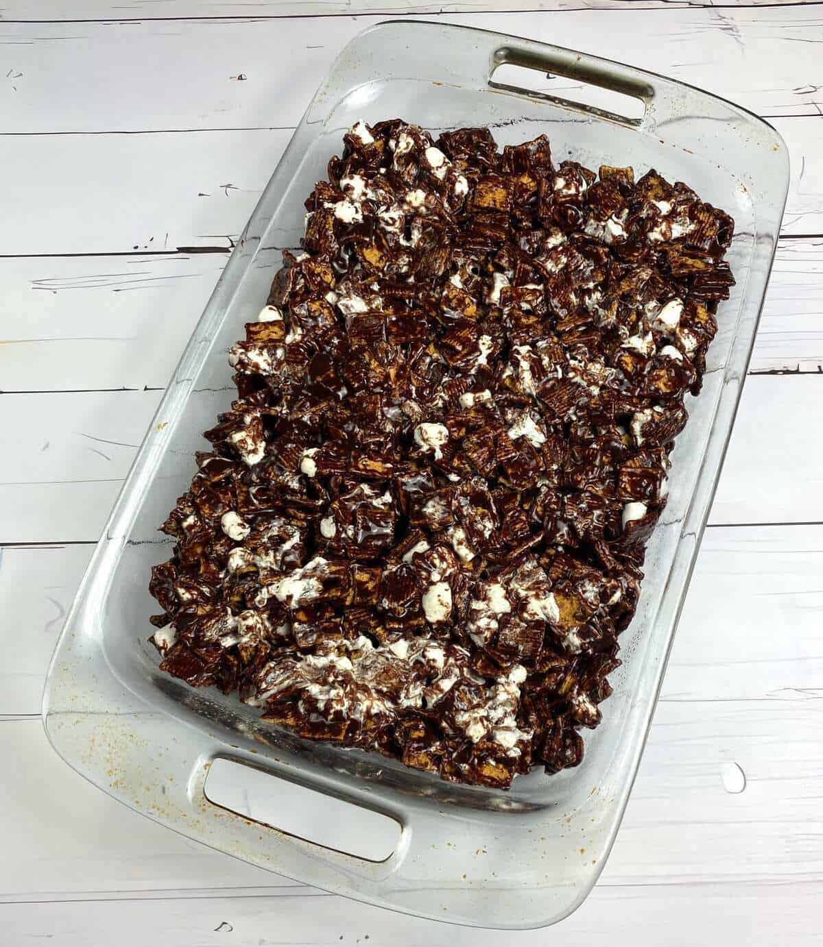 A glas casserole dish filled with a batch of no bake smores bars.