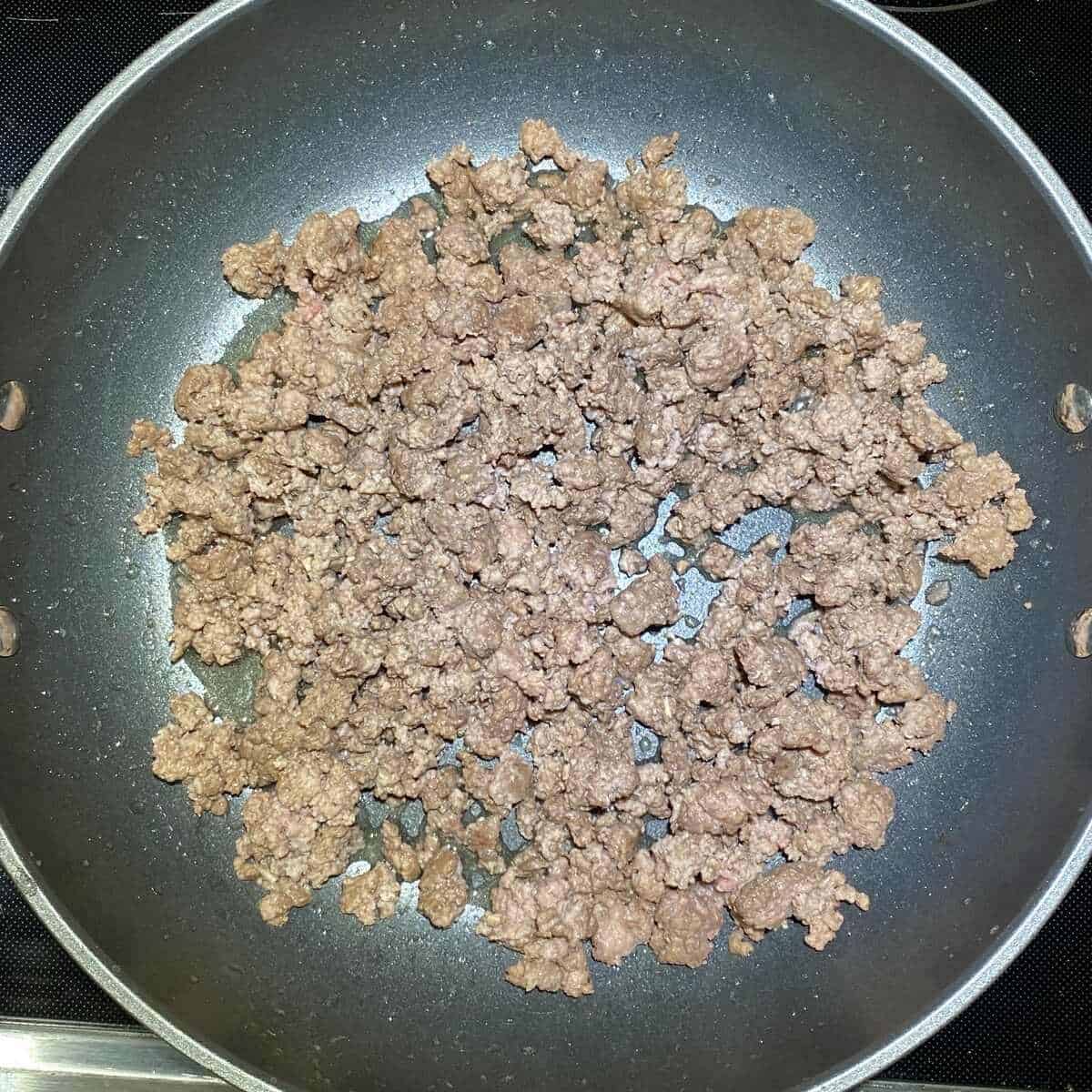 Ground beef cooked in a nonstick saute pan.