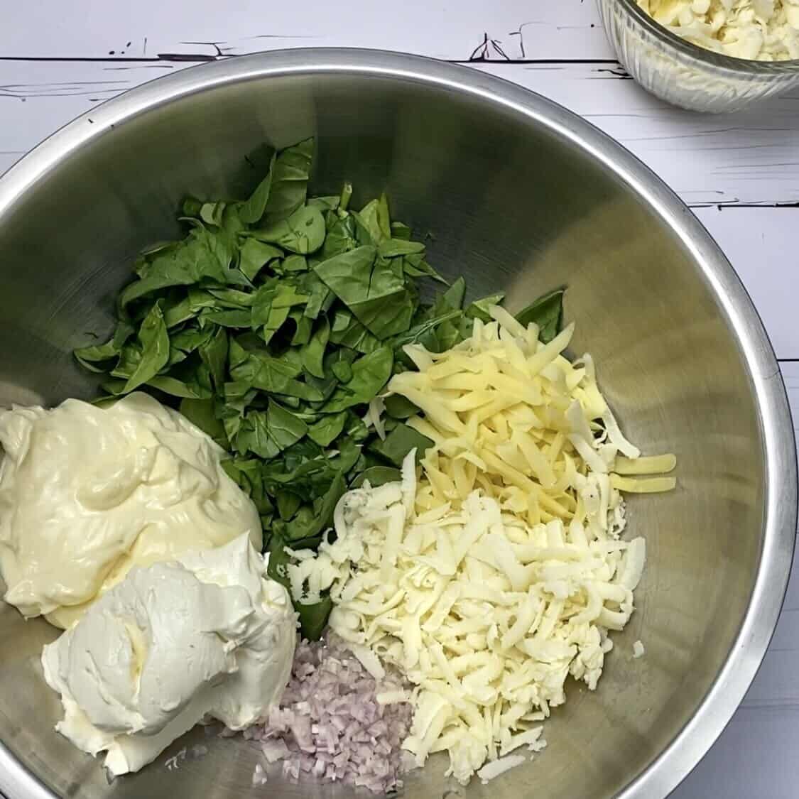 A bowl holding ingredients before they've been stirred together.