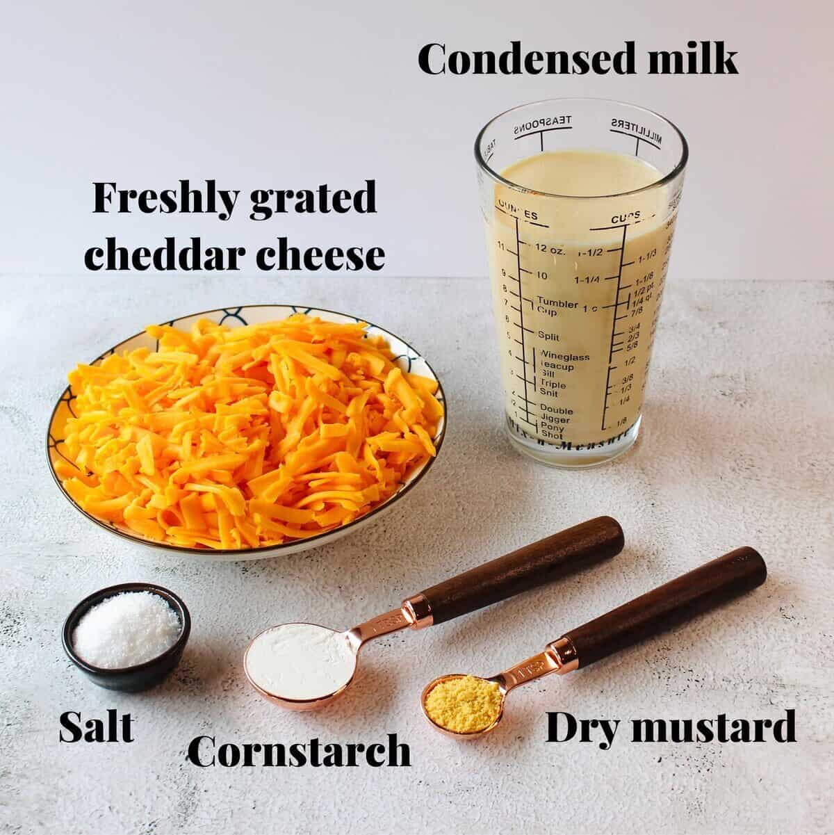 All the ingredients needed to make cheese sauce.