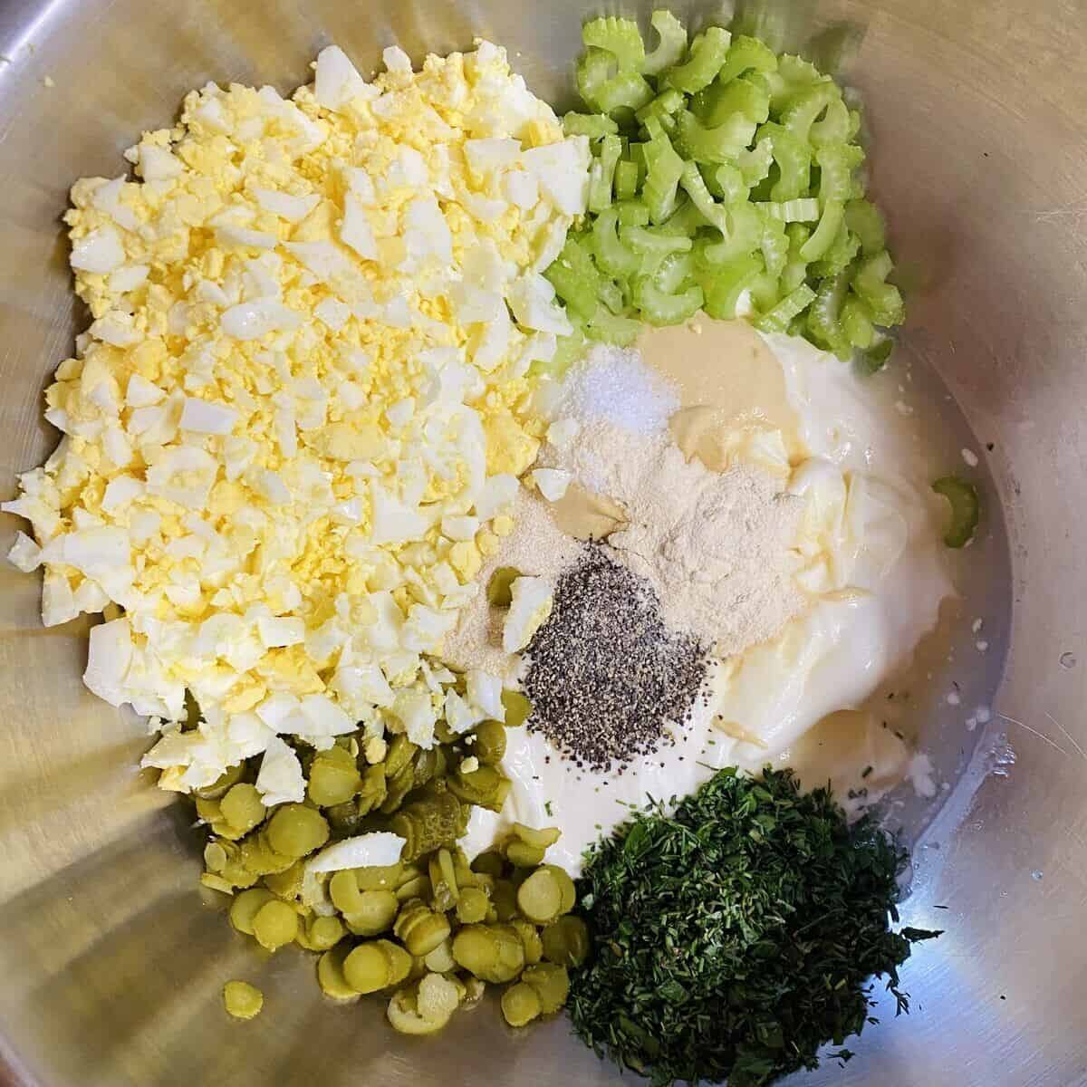 All the ingredients for the potato salad dressing in a bowl.