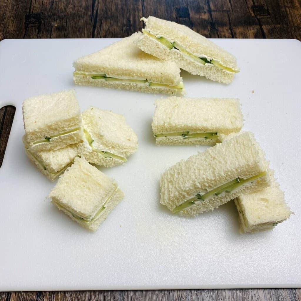 Traditional cucumber sandwiches cut into different tea sandwich shapes.