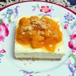 A serving of no bake peaches and cream dessert on a floral plate.