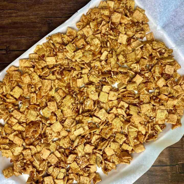 A sheet pan holding the crunch mix to cool.