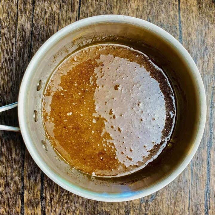 A soup pot with boiled sugar and cinnamon.