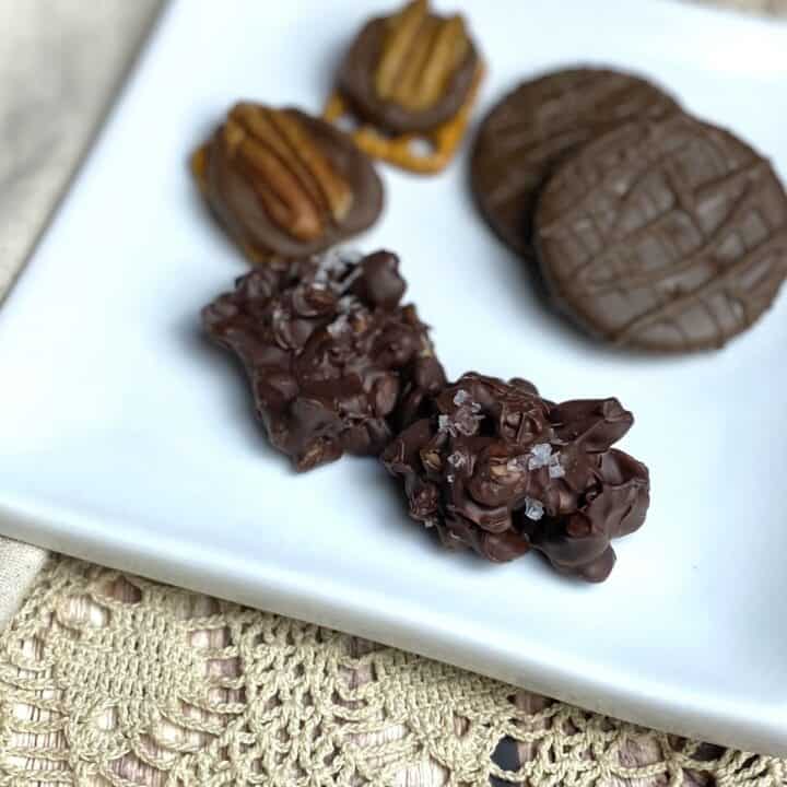 A close up of cashew cluster treats on a plate.