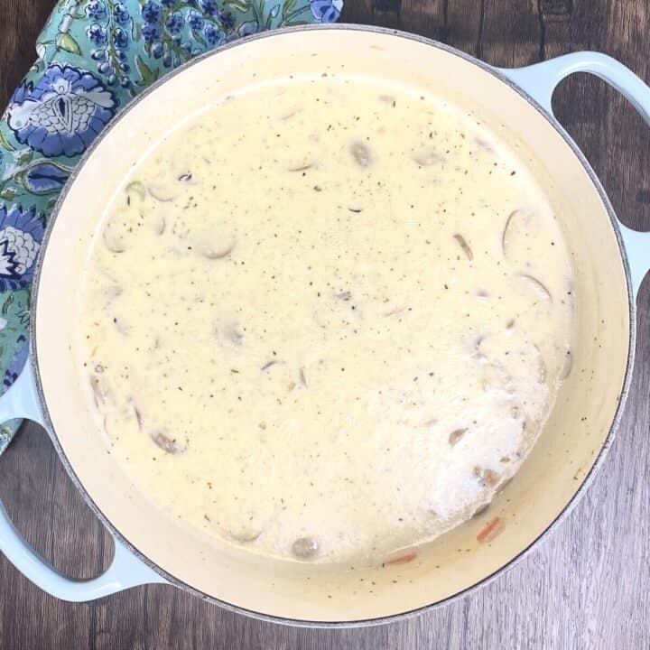 A full pot of soup and a napkin.