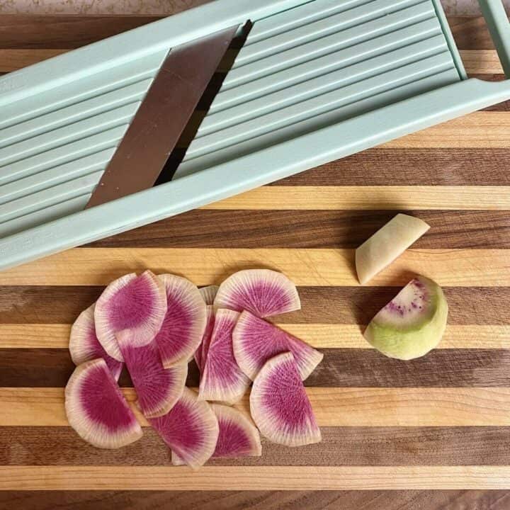 Watermelon radish on a cutting board.